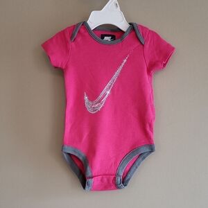 Nike hot pink onesie/bodysuit with silver swoosh